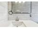 Close up of modern bathroom with new fixtures, stylish mirror and modern tile at 1110 Canal St, Ruskin, FL 33570