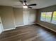 Large bedroom features wood flooring, neutral paint, and plenty of natural light at 1110 Canal St, Ruskin, FL 33570