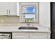 Close up of modern kitchen with bright sink and window allowing natural light at 1110 Canal St, Ruskin, FL 33570