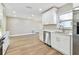 Beautiful kitchen featuring stainless steel appliances, white cabinets and countertops, and modern finishes at 1110 Canal St, Ruskin, FL 33570