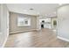 Open-concept living space with modern flooring and a view of the updated kitchen at 1110 Canal St, Ruskin, FL 33570