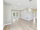 Spacious living room with sleek flooring, recessed lighting, and an airy, open layout at 1110 Canal St, Ruskin, FL 33570