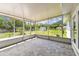 Enclosed patio with tiled floor and views of the backyard at 1110 Canal St, Ruskin, FL 33570