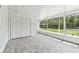 Enclosed patio with tiled floor, white closet, and natural light at 1110 Canal St, Ruskin, FL 33570