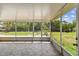 Inviting screened porch with tiled flooring offers a tranquil spot to enjoy the outdoor views and fresh air at 1110 Canal St, Ruskin, FL 33570