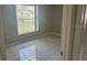 Cozy bedroom with neutral walls and tile flooring at 116 Cranbrooke Dr, Seffner, FL 33584