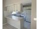 Well-lit kitchen with white cabinets and modern appliances at 116 Cranbrooke Dr, Seffner, FL 33584