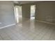 Open-concept living space featuring tile floors and access to kitchen at 116 Cranbrooke Dr, Seffner, FL 33584