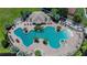 An impressive aerial view of a community clubhouse and large resort-style pool at 11728 Crest Creek Dr, Riverview, FL 33569