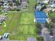This aerial view highlights the community's soccer fields, blue tennis/basketball courts, and convenient parking at 11728 Crest Creek Dr, Riverview, FL 33569