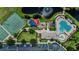 Aerial view of resort-style community pool, playground, and tennis courts at 11728 Crest Creek Dr, Riverview, FL 33569