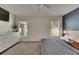 Bedroom displaying a bed, dresser, and view from two windows at 11728 Crest Creek Dr, Riverview, FL 33569