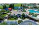 Stunning aerial view of the clubhouse, pool area and surrounding greenspace at 11728 Crest Creek Dr, Riverview, FL 33569