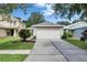 Well-maintained single-Gathering home with manicured lawn and a concrete driveway at 11728 Crest Creek Dr, Riverview, FL 33569