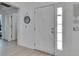 Bright foyer with a large front door and neutral tile flooring at 11728 Crest Creek Dr, Riverview, FL 33569