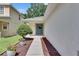 Inviting front entrance with a stylish door, decorative wreath, and landscaped garden at 11728 Crest Creek Dr, Riverview, FL 33569