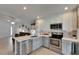 Stylish kitchen featuring stainless appliances and open layout to the living room at 11728 Crest Creek Dr, Riverview, FL 33569