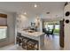 Bright kitchen with white cabinets, stainless steel appliances, and adjacent dining area at 11728 Crest Creek Dr, Riverview, FL 33569