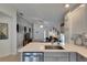 Modern kitchen with stainless steel appliances overlooking the living area and front entrance at 11728 Crest Creek Dr, Riverview, FL 33569