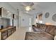 Inviting living room with light-colored floors, sectional sofa, and stylish decor at 11728 Crest Creek Dr, Riverview, FL 33569