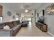 Spacious open-concept living room with hardwood floors and contemporary furnishings at 11728 Crest Creek Dr, Riverview, FL 33569