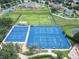 Aerial view showcasing community basketball and tennis courts, and green space at 11728 Crest Creek Dr, Riverview, FL 33569