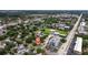 Expansive aerial view of the neighborhood featuring lush greenery and nearby baseball field, conveniently located near major thoroughfare at 131 44Th N Ave, St Petersburg, FL 33703