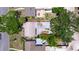 A top-down aerial shot of the property, showcasing a roof, patio, and mature landscaping at 131 44Th N Ave, St Petersburg, FL 33703