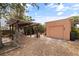 View of backyard with pergola and garage, with gravel and paver ground cover at 131 44Th N Ave, St Petersburg, FL 33703