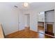 Bedroom with hardwood floors, closet, and views to the adjacent room at 131 44Th N Ave, St Petersburg, FL 33703