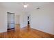 Bright bedroom features hardwood floors, closet with mirrored sliding doors, and ceiling fan at 131 44Th N Ave, St Petersburg, FL 33703