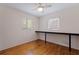 Bedroom with hardwood floors, a ceiling fan, and two windows at 131 44Th N Ave, St Petersburg, FL 33703