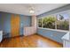 Sunny dining room features hardwood floors, built-in cabinets, and an abundance of natural light at 131 44Th N Ave, St Petersburg, FL 33703