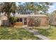 Charming single-story home featuring a stone pathway, manicured lawn, and inviting front porch at 131 44Th N Ave, St Petersburg, FL 33703