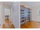 Hallway featuring hardwood floors and built-in shelving at 131 44Th N Ave, St Petersburg, FL 33703
