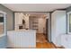 Open kitchen view features white cabinets, granite countertops, and stainless steel appliances at 131 44Th N Ave, St Petersburg, FL 33703