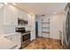 Modern kitchen featuring stainless steel appliances, granite countertops and tiled floors at 131 44Th N Ave, St Petersburg, FL 33703