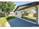 Backyard with a patio and large sliding glass doors, seamlessly blending indoor and outdoor living at 14261 113Th Ave, Largo, FL 33774