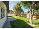 Expansive backyard with a gazebo, lush greenery, and a privacy fence, perfect for outdoor enjoyment at 14261 113Th Ave, Largo, FL 33774