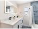 Modern bathroom with double vanity, quartz countertops, elegant finishes, and a bathtub shower at 14261 113Th Ave, Largo, FL 33774