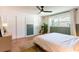 Bright bedroom featuring hardwood floors, a sliding-door closet, and a ceiling fan for added comfort at 14261 113Th Ave, Largo, FL 33774