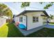 Home exterior with kayaks stored alongside the house, showcasing outdoor lifestyle appeal at 14261 113Th Ave, Largo, FL 33774