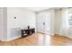 Inviting foyer with light wood flooring, a modern front door, and a decorative shoe rack at 14261 113Th Ave, Largo, FL 33774