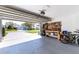 Spacious garage featuring an organized workbench and storage with access to the driveway and well-maintained front yard at 14261 113Th Ave, Largo, FL 33774