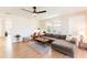Inviting living room featuring hardwood floors, large windows, and a comfortable seating arrangement at 14261 113Th Ave, Largo, FL 33774