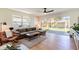 Cozy living room featuring a sliding glass door to a backyard with a patio and fenced yard at 14261 113Th Ave, Largo, FL 33774
