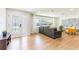 Bright living room with wood flooring, stylish decor, and a large window offering natural light at 14261 113Th Ave, Largo, FL 33774