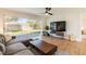 Cozy living room with hardwood floors and sliding glass doors to a landscaped backyard at 14261 113Th Ave, Largo, FL 33774