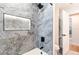 Luxurious shower features marble tiling, a built-in niche, and black fixtures for a spa-like experience at 14261 113Th Ave, Largo, FL 33774