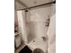 Bathroom featuring a walk-in shower with a curtain at 16725 Delia St, Wimauma, FL 33598